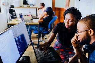 woman teaching on computer