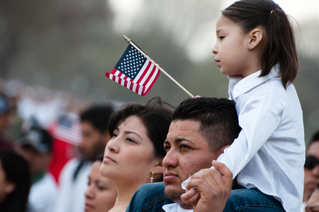 Immigrant family with American flag