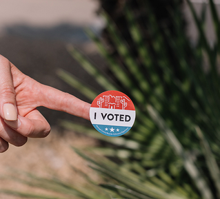 hand showing voting sticker