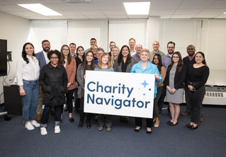Charity Navigator staff with logo