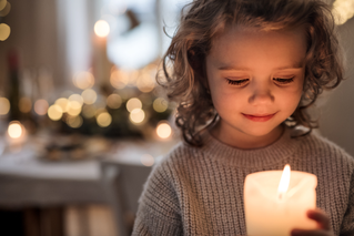 child with candle