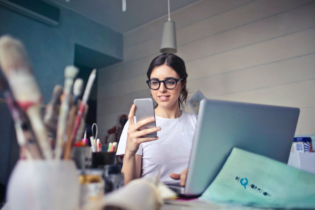 Young person looking at her phone