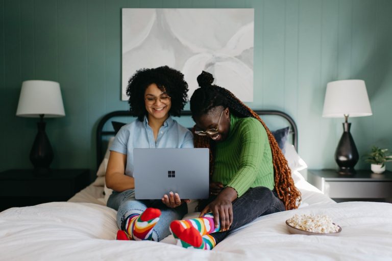 black friends looking at computer