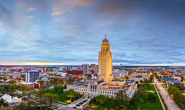 An image of Lincoln, Nebraska's capitol building in the evening.